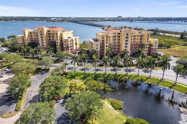 birds eye view of property with a water view