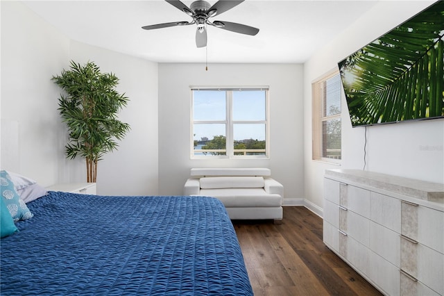 bedroom with dark wood-type flooring and ceiling fan