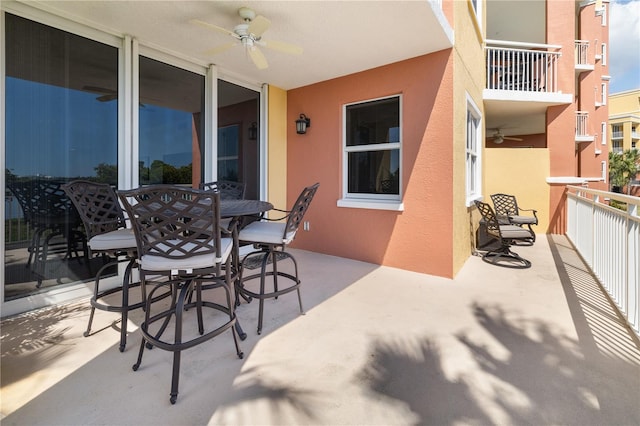 view of patio / terrace featuring a balcony and ceiling fan