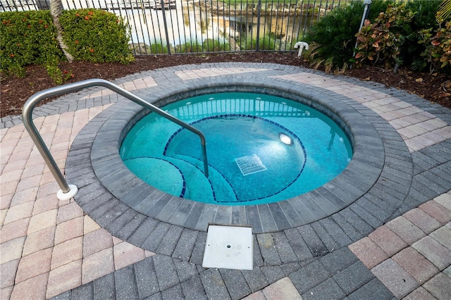 view of pool featuring a community hot tub