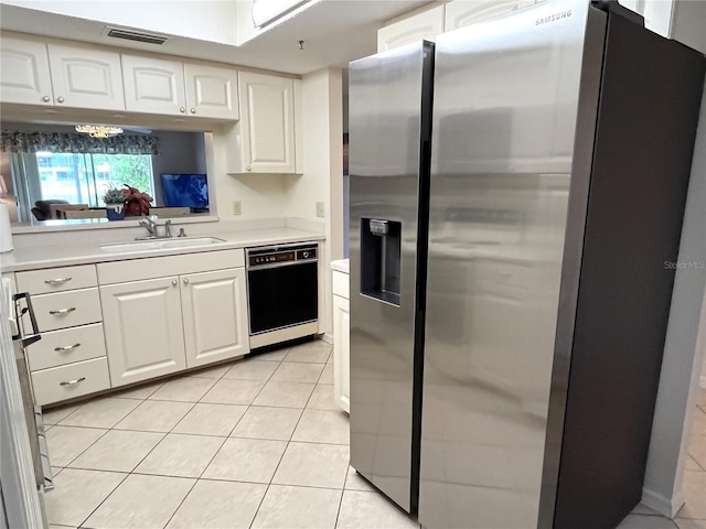 kitchen featuring dishwasher, light countertops, white cabinetry, stainless steel refrigerator with ice dispenser, and a sink