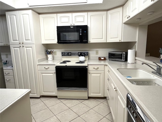 kitchen featuring light tile patterned flooring, a sink, white cabinetry, light countertops, and black appliances