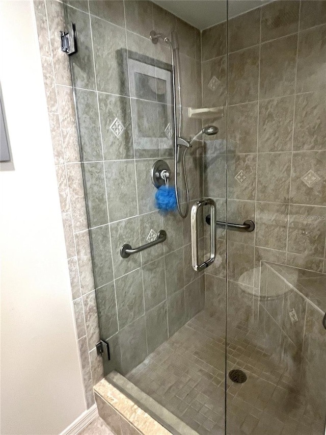 full bathroom with a shower stall