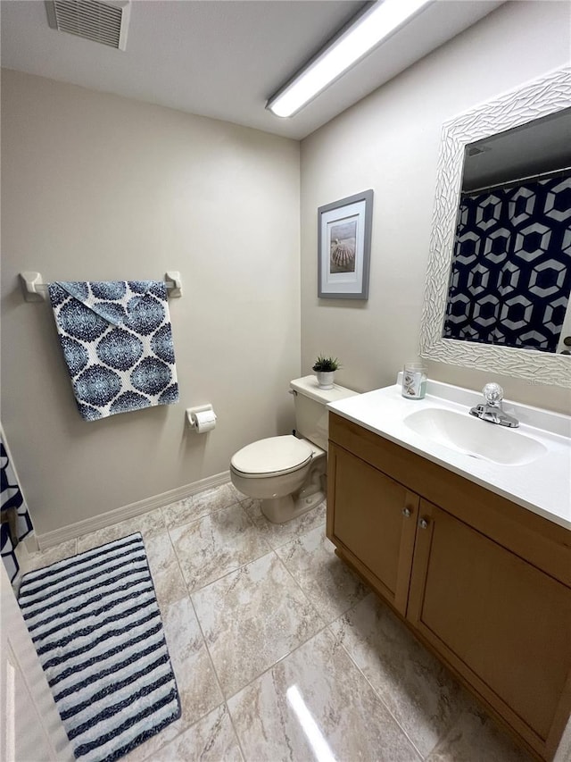 full bathroom featuring baseboards, visible vents, vanity, and toilet