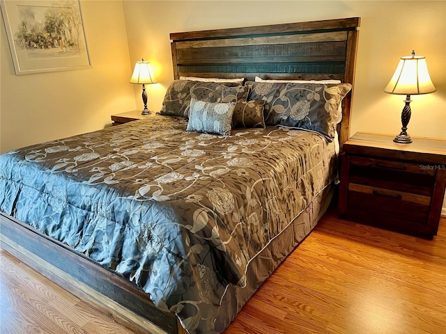 bedroom featuring light wood-style flooring