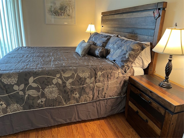 bedroom with wood finished floors