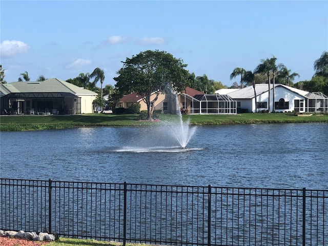 water view featuring a residential view and fence