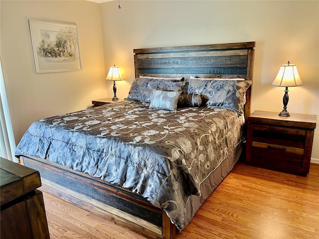 bedroom featuring light wood finished floors