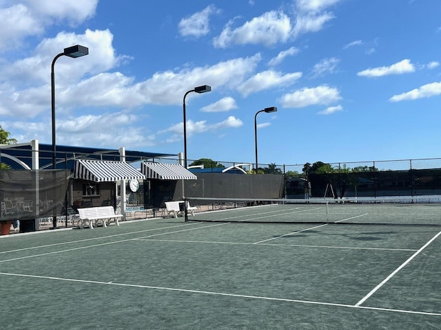 view of sport court with fence