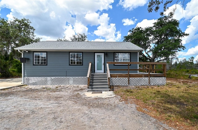 view of front of home featuring a wooden deck