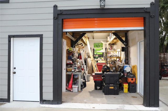 garage featuring wood walls