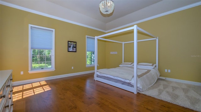 bedroom featuring wood-type flooring and a notable chandelier