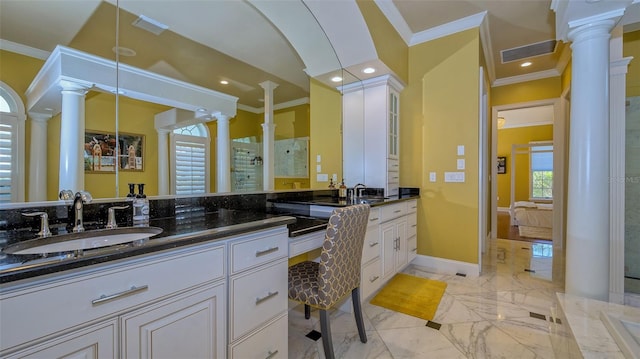 bathroom featuring ornate columns, vanity, tile floors, and ornamental molding