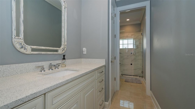 bathroom with walk in shower, crown molding, tile flooring, and vanity