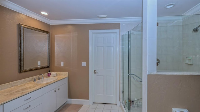 bathroom with ornamental molding, an enclosed shower, tile floors, and vanity