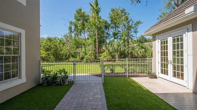 view of yard featuring french doors and a patio area