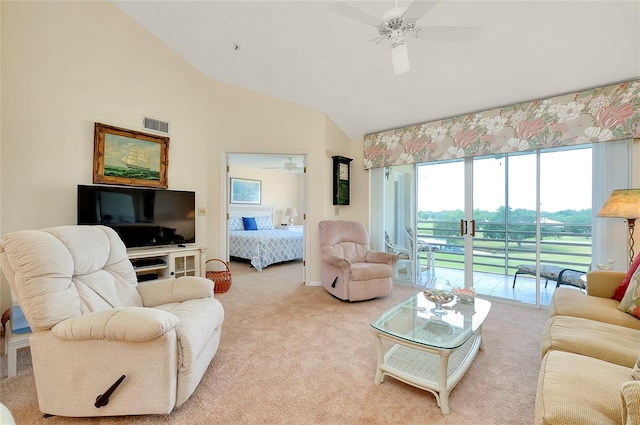 living room featuring carpet flooring, ceiling fan, and lofted ceiling