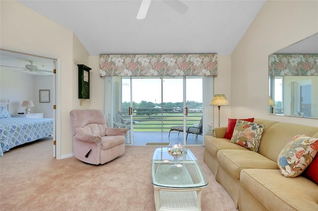 living room featuring lofted ceiling, ceiling fan, and carpet floors