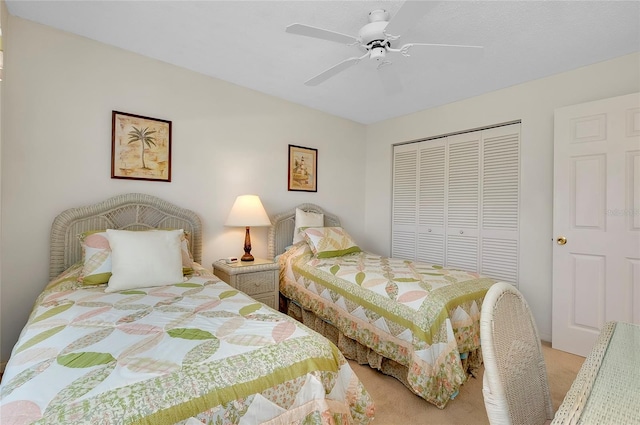 bedroom featuring a closet, ceiling fan, and carpet