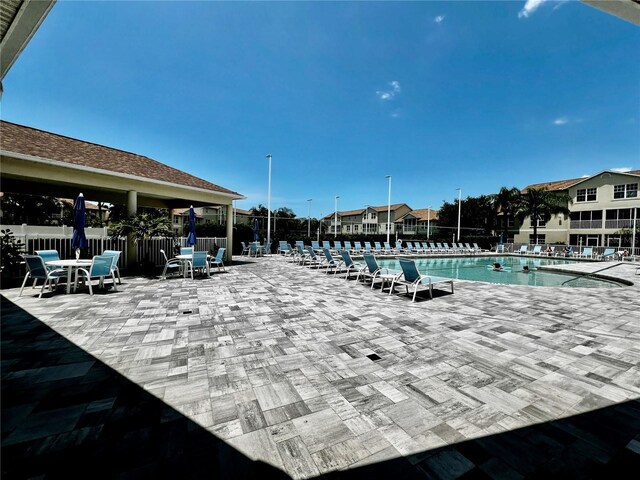 view of swimming pool featuring a patio area