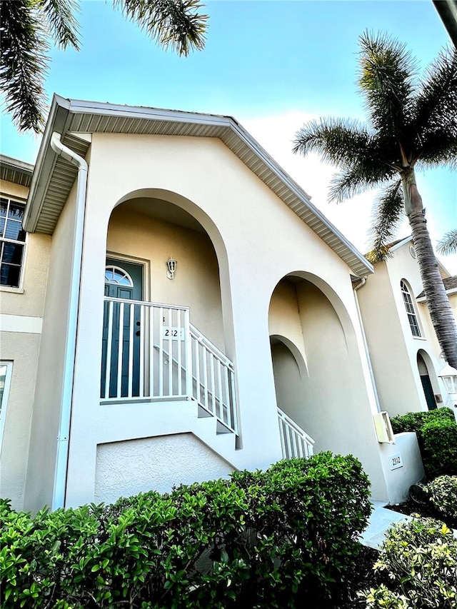 doorway to property featuring a balcony