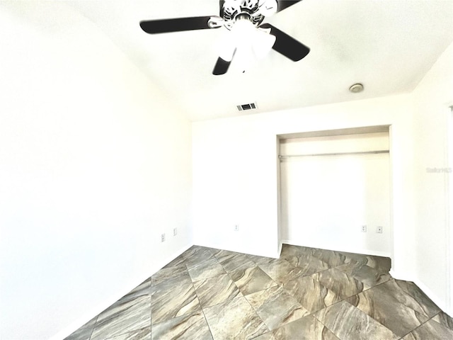 unfurnished bedroom with a closet and ceiling fan