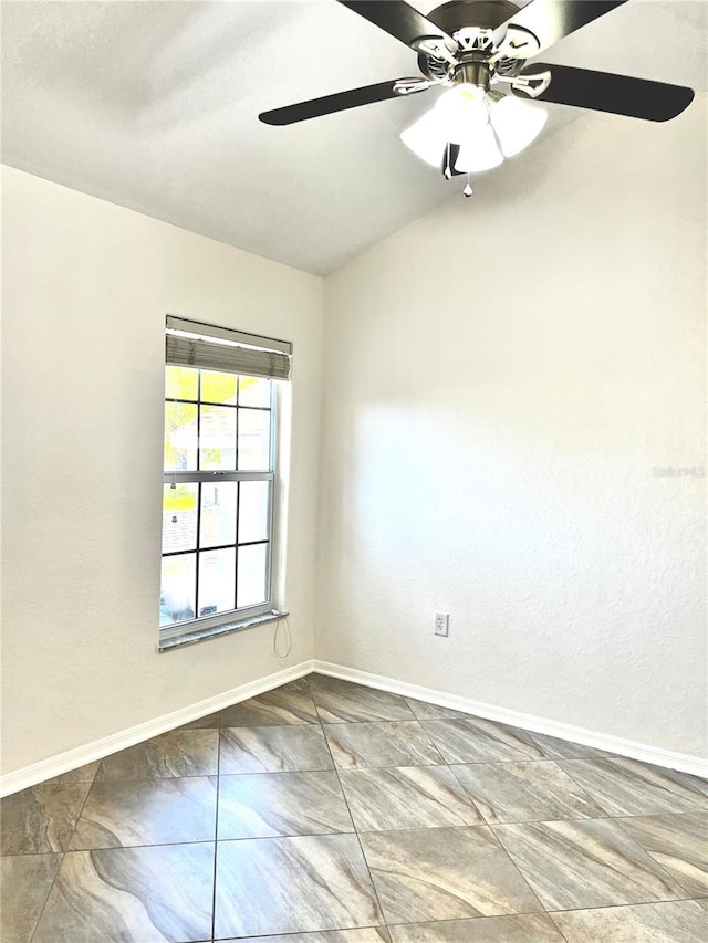 unfurnished room with ceiling fan and lofted ceiling