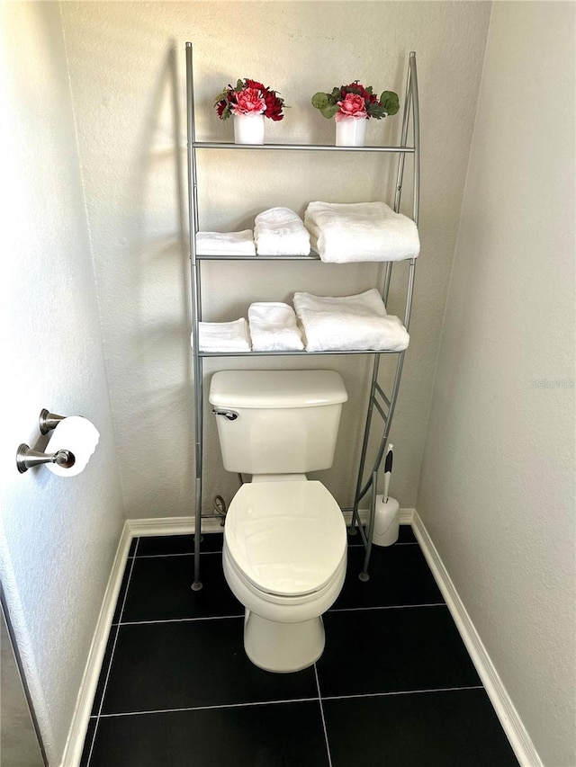 bathroom featuring tile patterned flooring and toilet