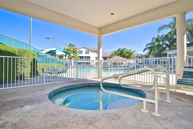 view of swimming pool with a patio