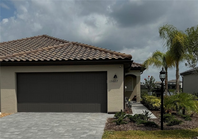 mediterranean / spanish house with a garage