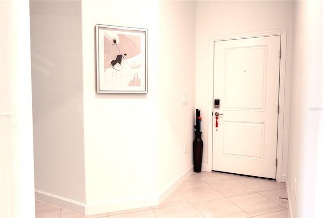 doorway featuring light tile flooring