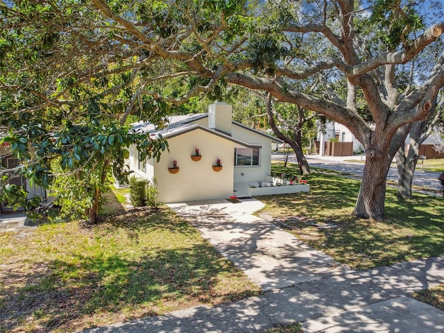 view of outbuilding with a lawn