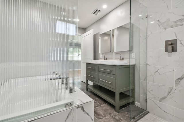 bathroom with a shower, vanity, and tile walls