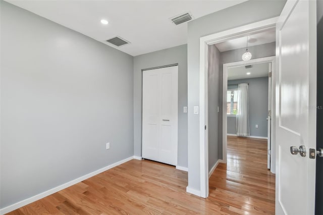 interior space featuring light hardwood / wood-style floors and a closet