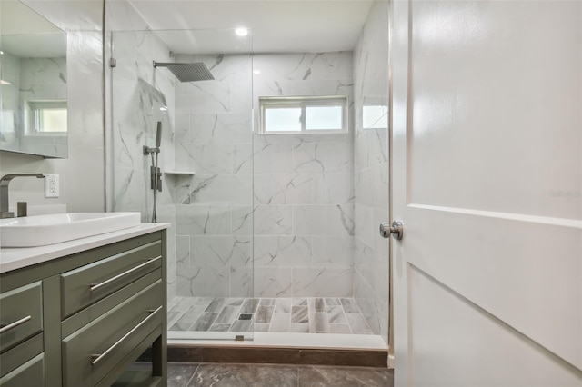 bathroom featuring vanity and a tile shower