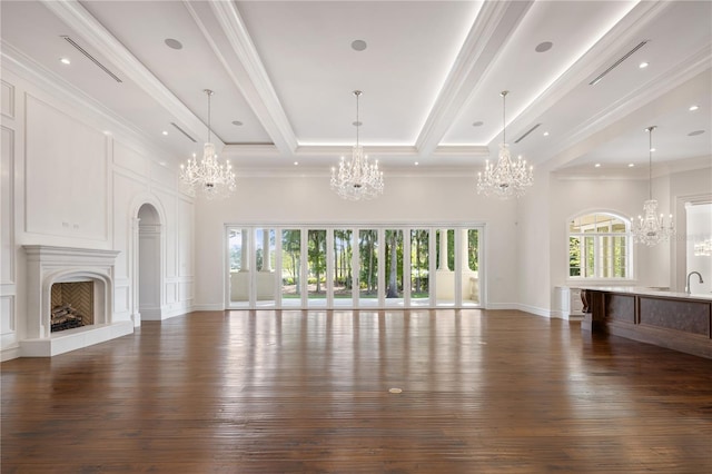 unfurnished living room featuring beamed ceiling, a chandelier, crown molding, and dark wood-type flooring