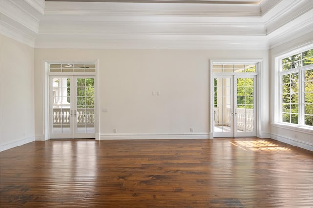 unfurnished room featuring french doors, crown molding, and dark wood-type flooring