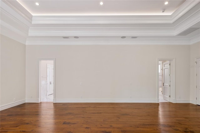 empty room featuring dark hardwood / wood-style flooring and crown molding