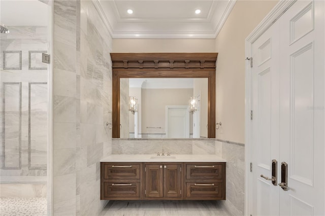 bathroom with tile walls, walk in shower, backsplash, vanity, and ornamental molding