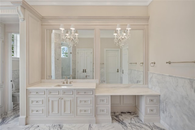 bathroom with tile flooring, tile walls, a notable chandelier, crown molding, and vanity