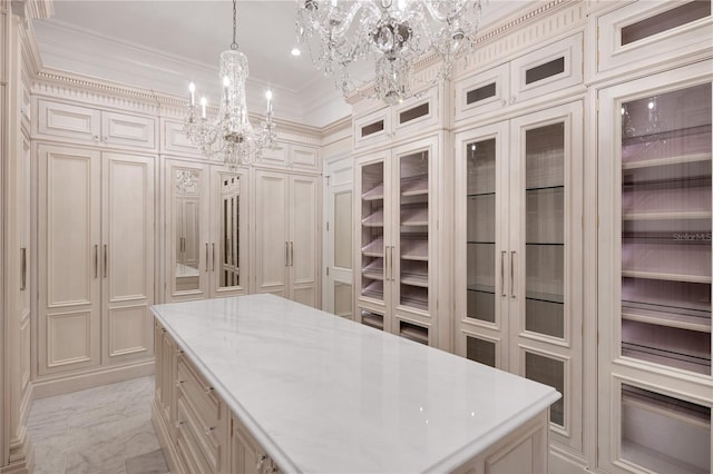 walk in closet with a chandelier and light tile floors