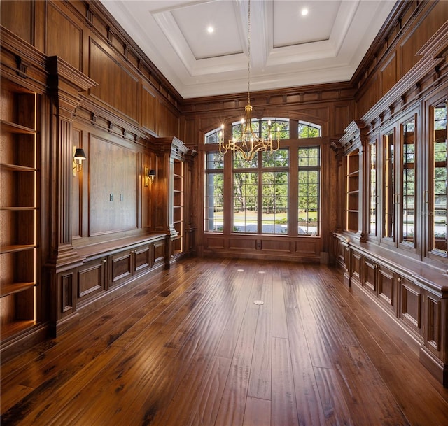 interior space with wooden walls, coffered ceiling, dark wood-type flooring, and crown molding