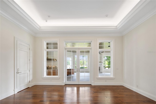 empty room with french doors, ornamental molding, and dark hardwood / wood-style floors