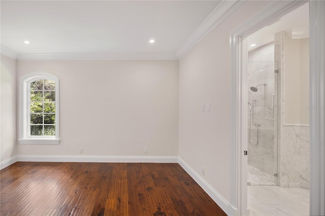 unfurnished room with crown molding and hardwood / wood-style flooring