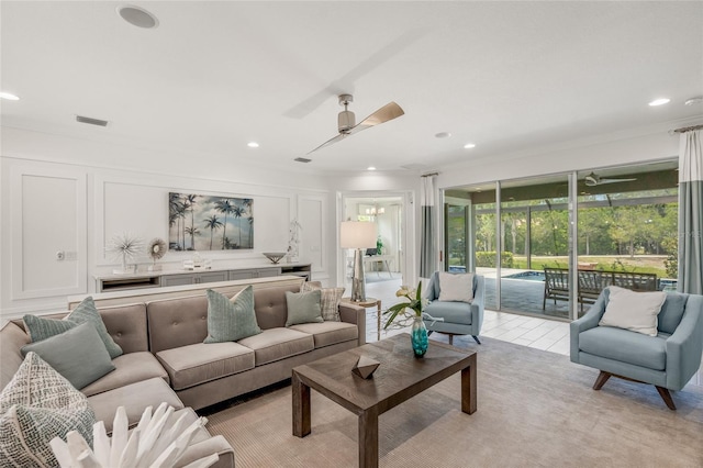 living room featuring light colored carpet and ceiling fan