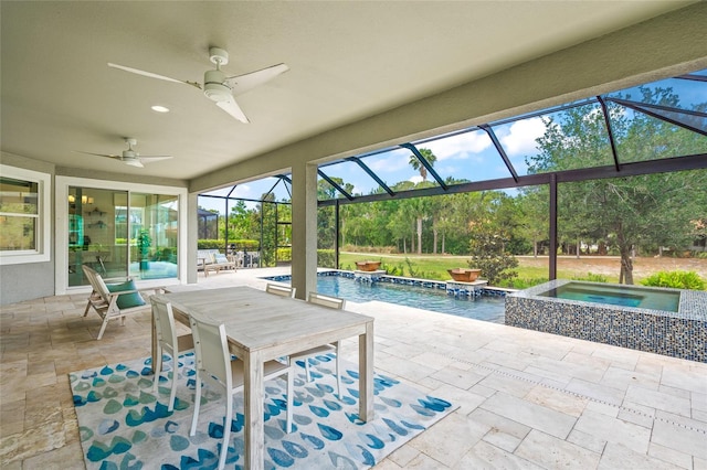 unfurnished sunroom featuring ceiling fan and a pool