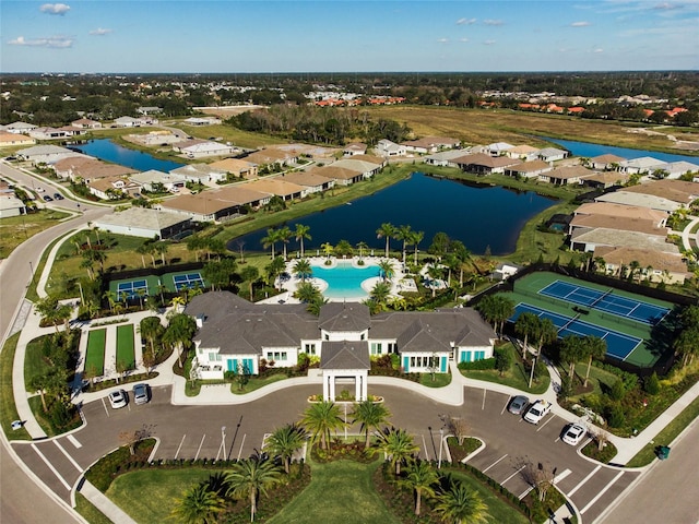 birds eye view of property with a water view