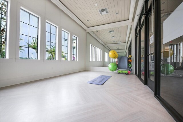 sunroom / solarium featuring a wealth of natural light and wood ceiling