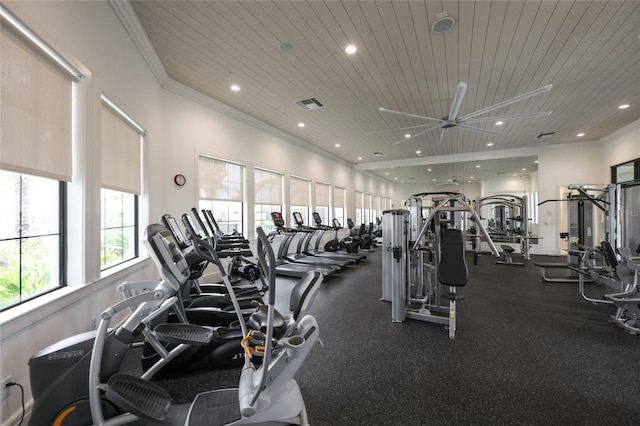 gym with ceiling fan and crown molding