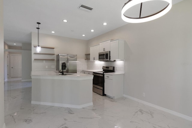 kitchen featuring a kitchen island with sink, white cabinetry, backsplash, stainless steel appliances, and light tile floors